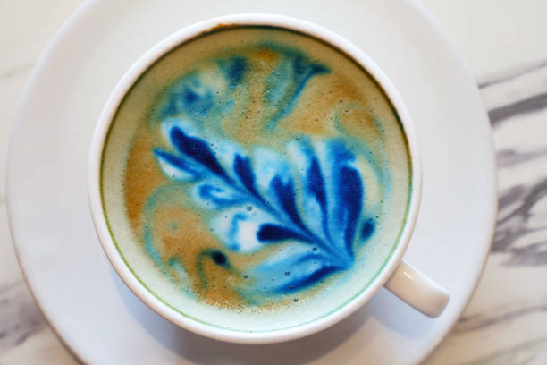 istock Mouthwatering cappuccino coffee with blue butterfly pea latte art 2194525002