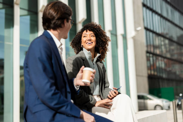 istock Business couple enjoying fun talks during their break 2194525974