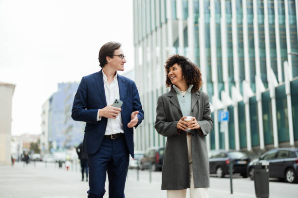 istock Colleagues chatting on their way to the company 2194526013