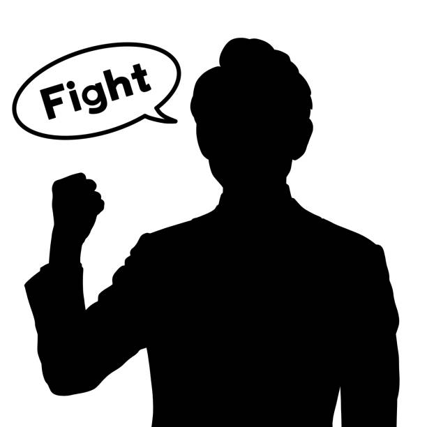Silhouette of a man doing a fist pump.