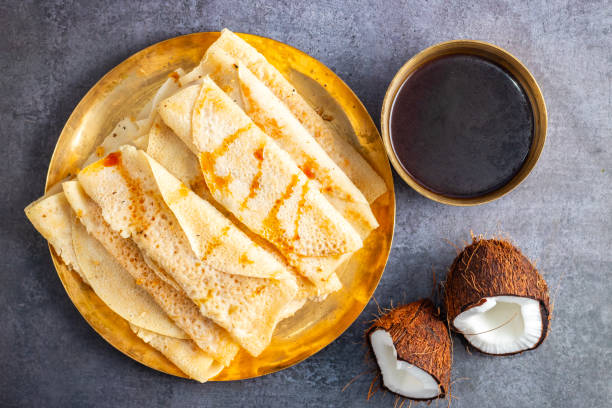 istock Pitha pulli is a traditional Bengali dish featuring rice flour dumplings stuffed with jaggery, coconut, and sometimes nuts. 2194526352