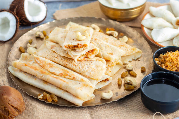 istock Pitha pulli is a traditional Bengali dish featuring rice flour dumplings stuffed with jaggery, coconut, and sometimes nuts. 2194526449