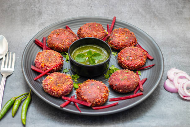 istock Beetroot tikka is a vibrant, vegetarian appetizer made with marinated beetroot, spices, and yogurt, grilled to perfection. 2194526953