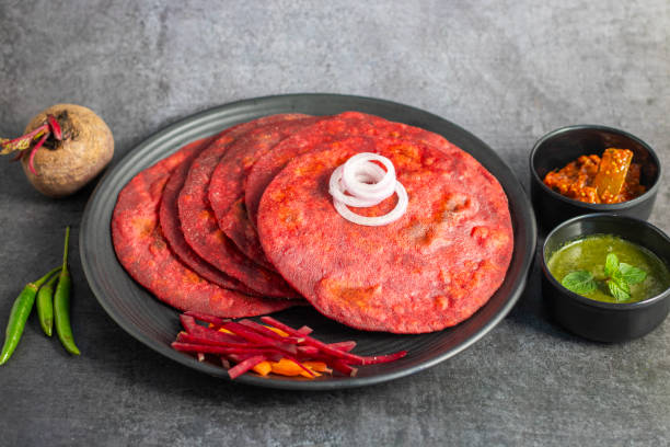 istock Beetroot paratha is a vibrant, whole-wheat flatbread stuffed with spiced, grated beetroot, offering a nutritious, flavorful twist on traditional paratha. 2194526968