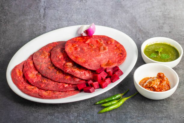 Beetroot paratha is a vibrant, whole-wheat flatbread stuffed with spiced, grated beetroot, offering a nutritious, flavorful twist on traditional paratha.