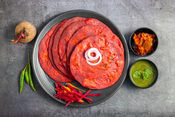 Beetroot paratha is a vibrant, whole-wheat flatbread stuffed with spiced, grated beetroot, offering a nutritious, flavorful twist on traditional paratha.