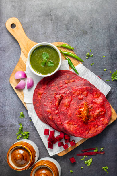 istock Beetroot paratha is a vibrant, whole-wheat flatbread stuffed with spiced, grated beetroot, offering a nutritious, flavorful twist on traditional paratha. 2194527165