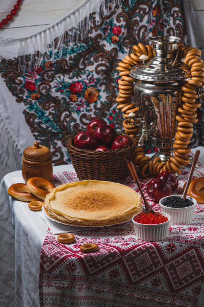istock Pancakes on the table with traditional patterns, next to the samovar, apples and caviar 2194529143
