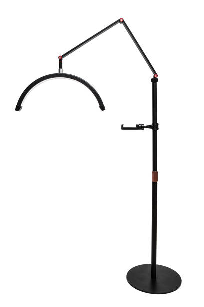 istock A sleek black floor lamp with an adjustable arm and curved LED light, perfect for modern interiors. 2194529816
