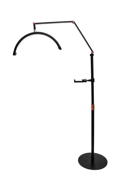 istock A sleek black floor lamp with an adjustable arm and curved LED light, perfect for modern interiors. 2194529836