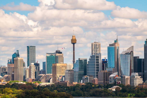 istock Sydney city skyline panorama with a plane taking off above 2194535805
