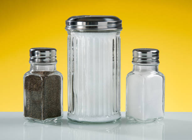 a wide mouthed cylindrical container made of glass or pottery and typically having a lid