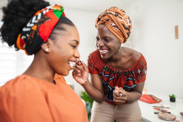 istock Two smiling women applying makeup and having fun 2194541721