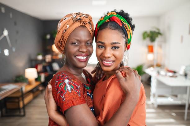 istock Two smiling afro-american women embracing and showing their affection 2194541761