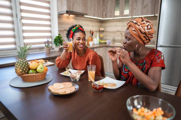 istock Two smiling women having breakfast in the kitchen 2194541911