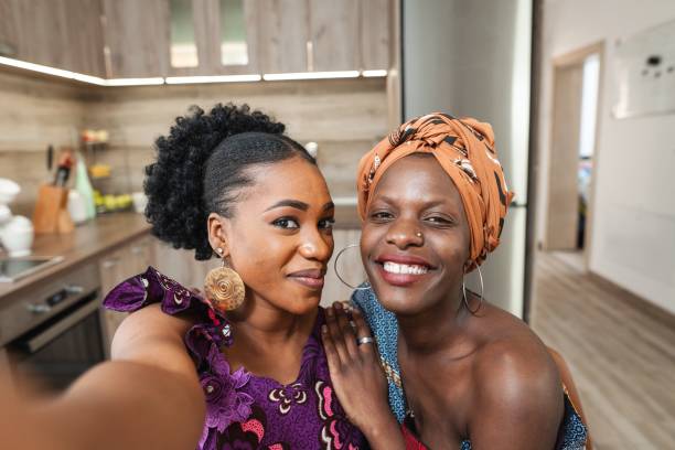 istock Two smiling women taking a selfie in their kitchen 2194542007