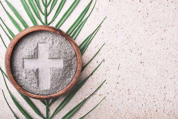 Ash Wednesday symbols cross in ashes and palm leaf