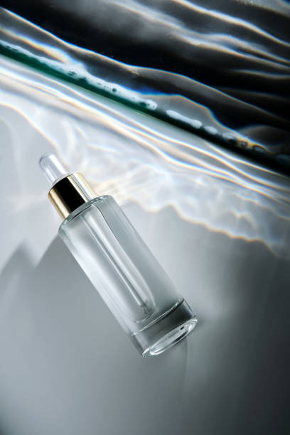 istock Bottle of face serum with a pipette with a beautiful highlight. 2194545791