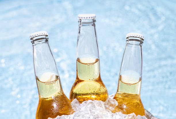 istock Three bottles of beer with ice cubes 2194546848