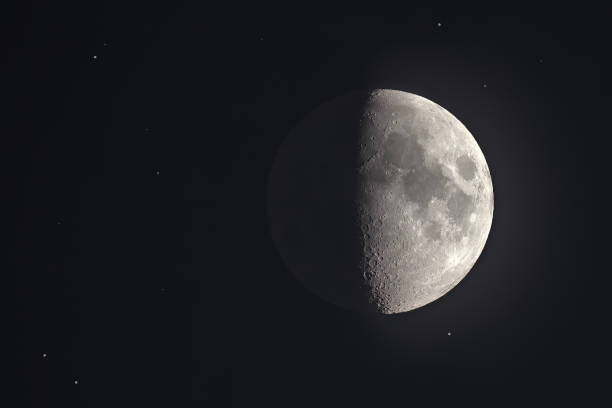 istock Half Moon Illuminated Against a Night Sky with Visible Stars 2194548699