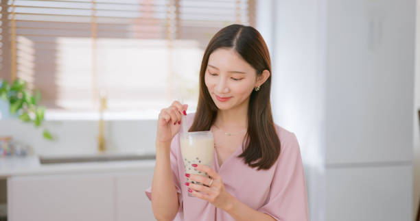 istock woman drink bubble tea home 2194548794