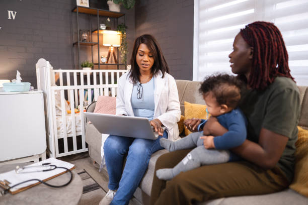 istock Pediatrician visiting baby at home for checkup using laptop 2194549182