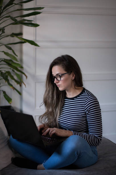 istock Young female freelancer working from home on her laptop computer. 2194549269