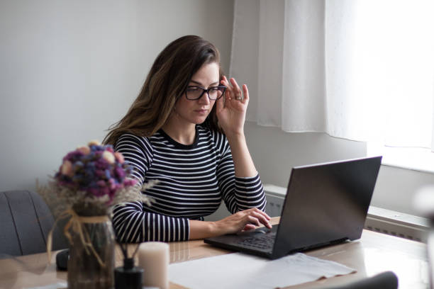 istock Young female freelancer working from home on her laptop 2194549289