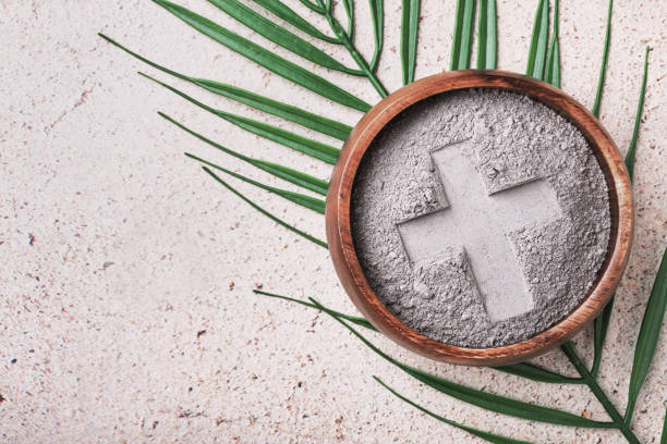 istock Ash wednesday background with cross in ashes and palm leaf 2194549670