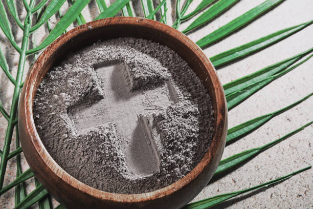 istock Ash Wednesday. Cross in ashes and palm leaf 2194549679