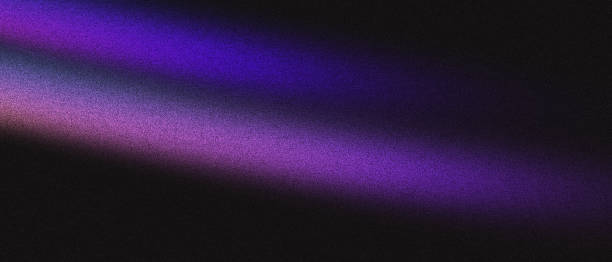 Vibrant gradient light on black background with pink and blue noise hues