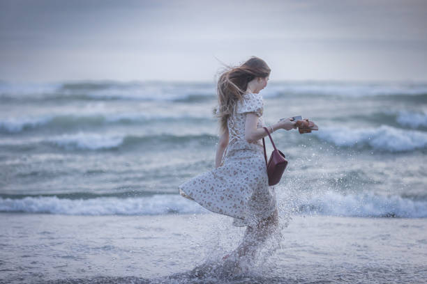 Pretty young Russian lady is walking on the beach.Bali Island - Indonesia.
