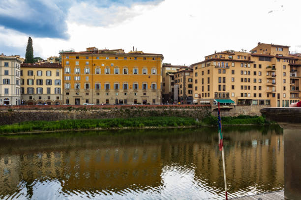 istock Historic Riverside Architecture in Florence Under Cloudy Sky 2194551244