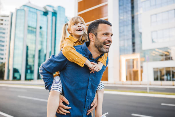 istock Father and daughter walking in the city. 2194554589