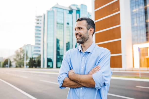 istock Portrait of casual smiling man 2194554603