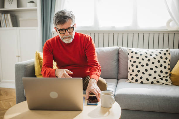 istock Mature man working from home 2194557296