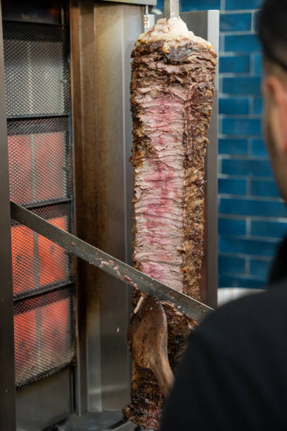 istock Chef slicing meat doner in a restaurant. 2194558652