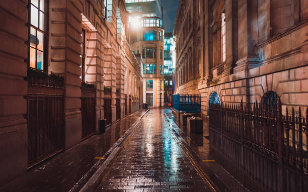 istock Narrow lane in London at night 2194559452