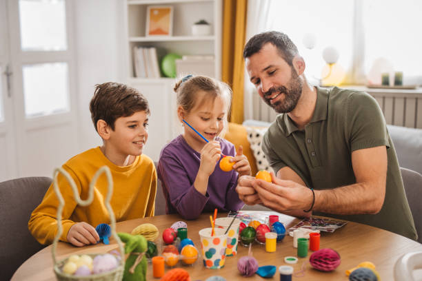 istock Happy family preparing Easter at home 2194561504