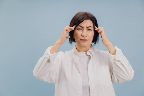 istock Mature Woman Suffering From Strong Headache or Migraine Attack 2194561765