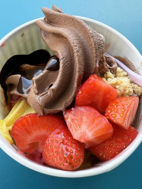 istock Delicious chocolate and strawberry ice cream bowl with toppings 2194563536
