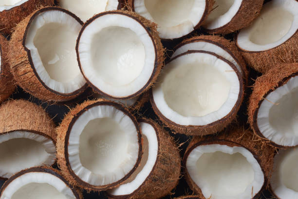 istock pile of coconuts cut in half in close-up view 2194565361