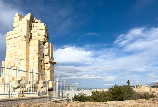 Athens, Greece, Philopappos Monument, blue sky with clouds background.
