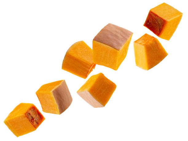 istock Pumpkin pieces fly in space forming a chain shape. Volumetric back light. Isolated on white 2194567063