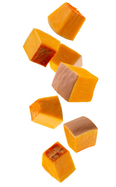 istock Pumpkin pieces falling in space. Volumetric back light. Isolated on white 2194567076