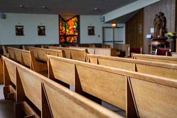 istock Wooden seating area inside a church 2194569752
