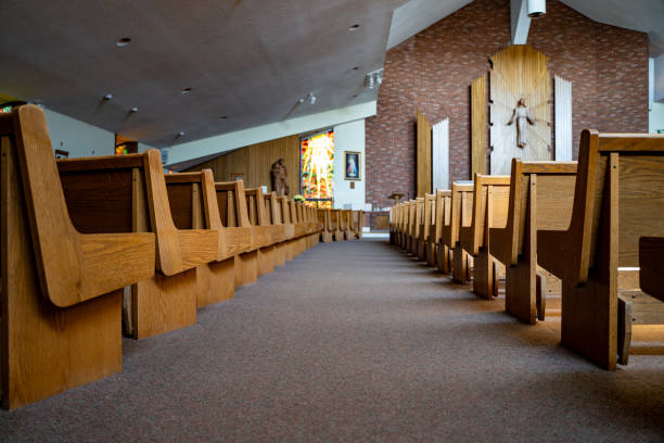 istock Wooden seating area inside a church 2194570578