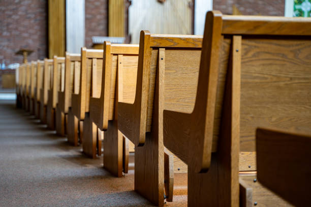 istock Wooden seating area inside a church 2194570750