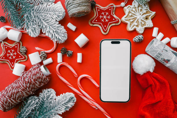 istock Phone with isolated screen against christmas decor background, online shopping 2194575702