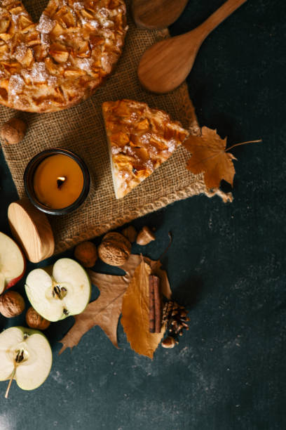 istock Candle and homemade apple pie, autumn mood 2194577411